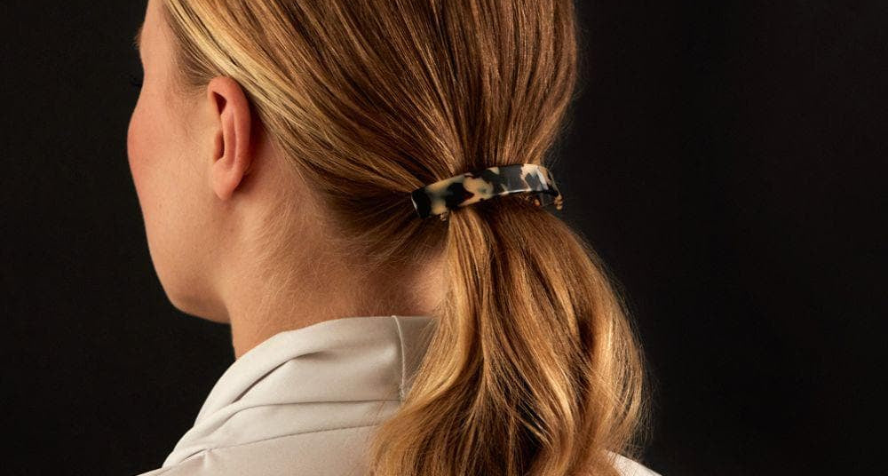 Low ponytail finished with a TEGEN French Handmade barrette
