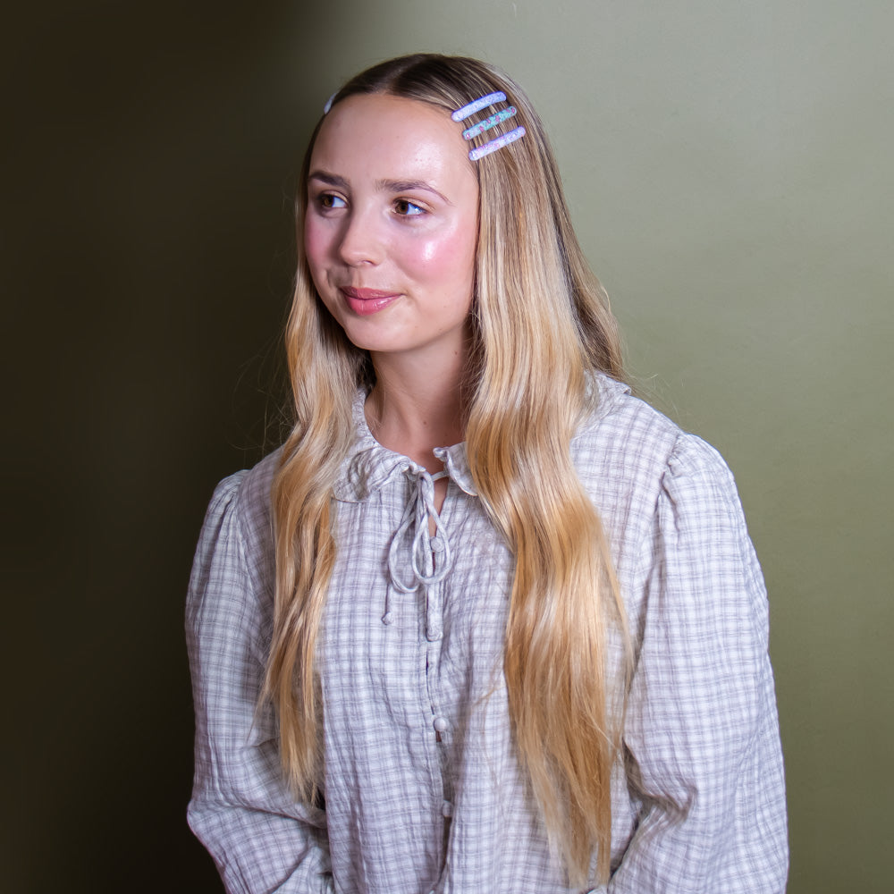 Narrow floral-patterned hair clips in pink blue and green